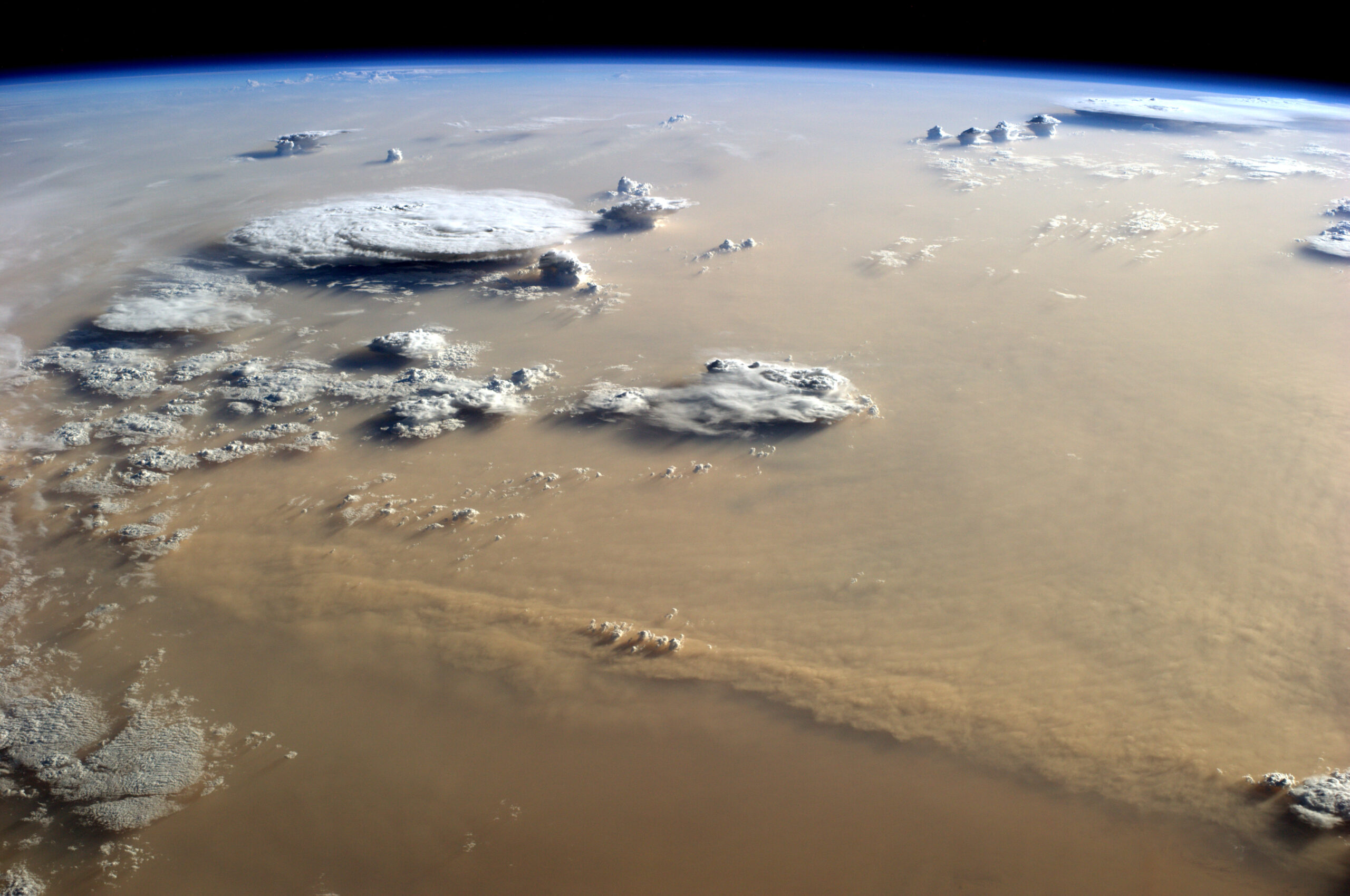 Photograph of a dust storm over the Sahara taken by Alex Gerst on the International Space Station